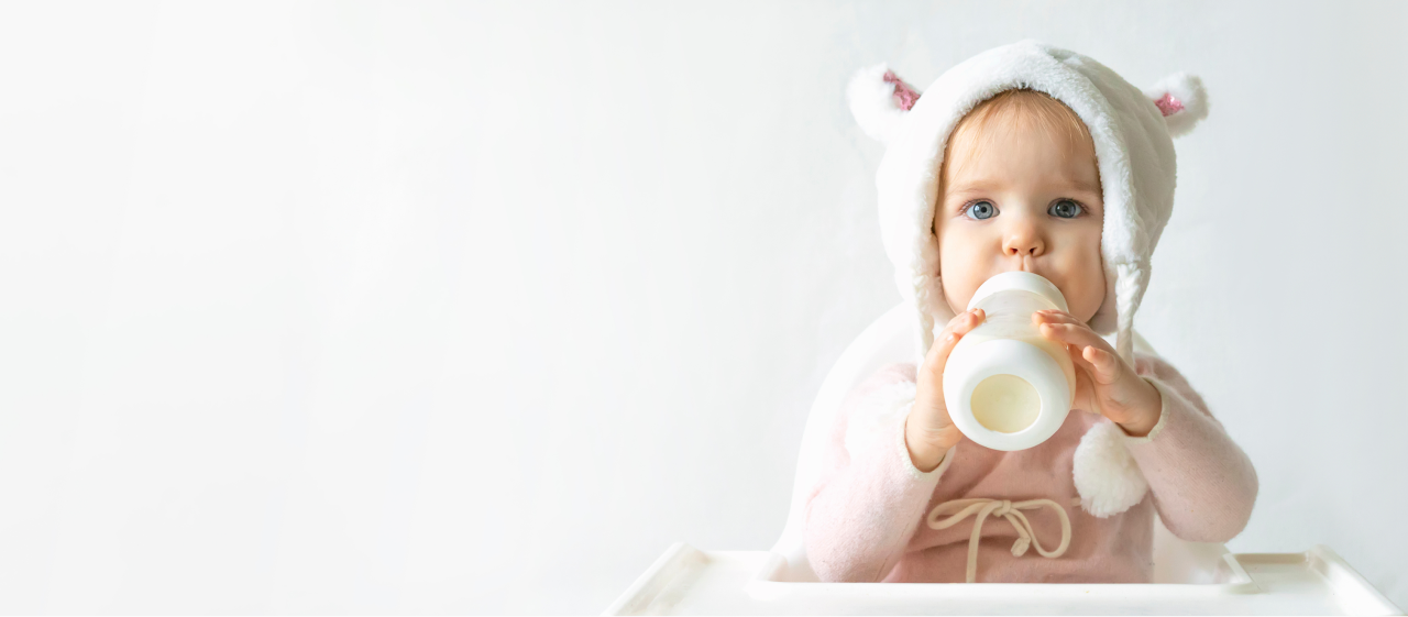 girl with milk bottle in rabbit costume